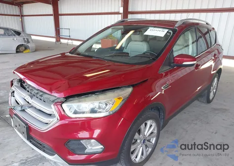 2017 Ford Escape Titanium z USA, uszkodzony, nr VIN 1FMCU0J98HUD29348